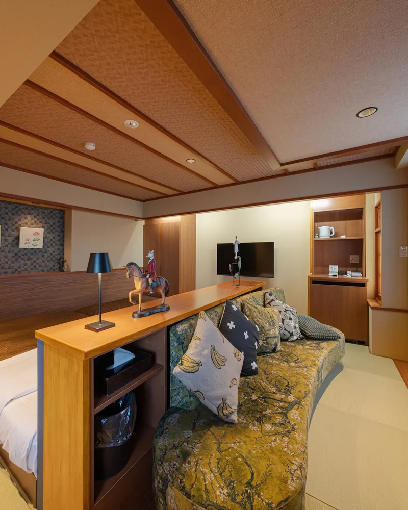 The sofa and the counter between the beds and the sitting area