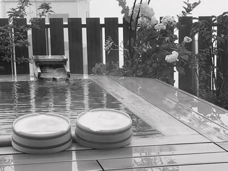 Steam rising from the rooftop open-air bath in the rain