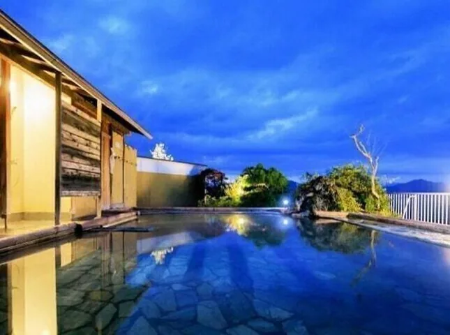 The rooftop open-air bath at dusk