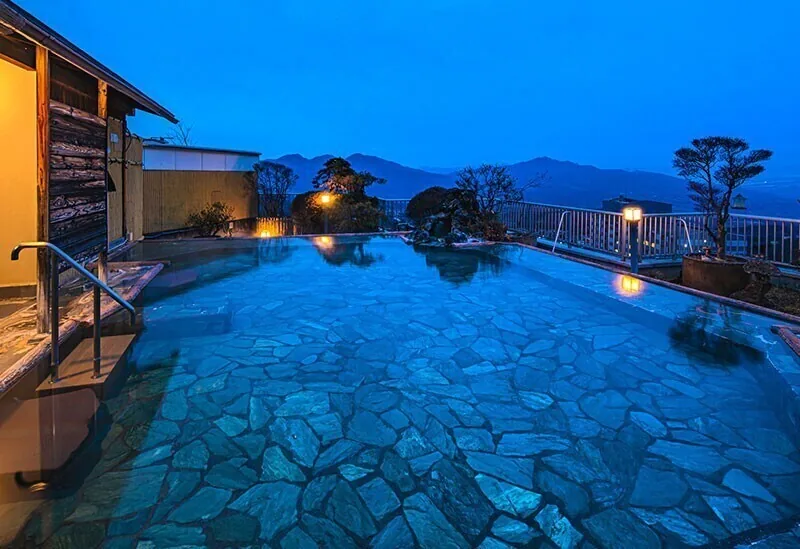 The rooftop open-air bath at dusk